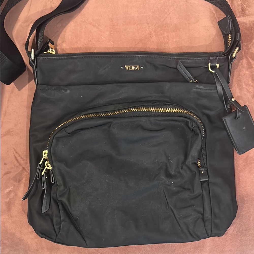 Tumi Black Messenger Bag with Adjustable Strap and Durable Fabric